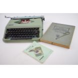 Vintage cased Antares Parva typewriter with The New Rational Typewriting book (2).