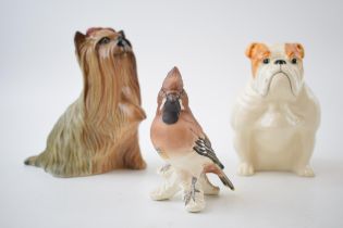Beswick Bulldog together with a Yorkshire Terrier with raised paw (second) together with a Goebel