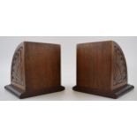 A pair of Edwardian bookends with inlaid decoration to top and carved design to front and back.