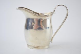 Silver cream jug of plain design with leaf handle, Birm 1918, 60.0 grams.