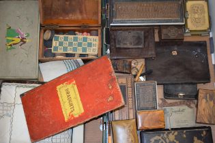 An interesting collection of items to include boxes, a draughts set, leather purses and others (