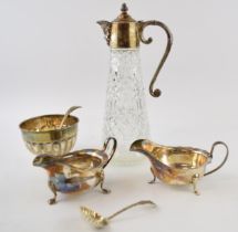 A collection of silver plated items to include cut glass claret jug, serving bowls and similar items