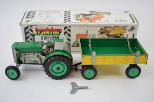 Boxed Zetor Traktor / Tractor and trailer, Kovap Czechoslovakia, in green colourway, with yellow