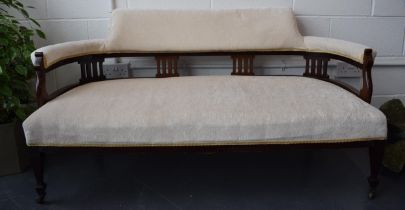 Edwardian upholstered sofa / couch on original casters. Recently reupholstered in a good quality