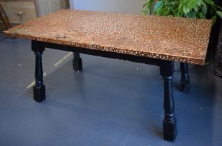 A low pub style table with hand-hammered copper top. 87cm x 45cm. Height 39cm.