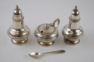 A hallmarked silver spoon, 9.1 grams, with a silver plated cruet set (4).