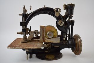 Willcox and Gibbs sewing machine, of New York, cast iron, 26cm long.