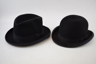 A black bowler hat, by New Raglan, opening 19.5cm x 15.5cm, in original paper bag 'Wilks & Son