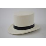 F R Tripler & Co pottery top hat in white and black colours, 10.5cm long. In good condition with