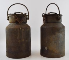 A pair of small milk churns with handles and original lids with chains. Height 30cm (not including