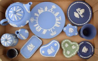 A collection of Wedgwood Jasperware to include teapot (seconds), bud vases, lidded pots, trinket