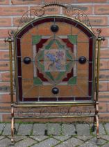 Arts and Crafts firescreen with copper and brass decoration and stained glass insert with floral