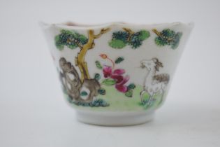Late 18th / early 19th century Chinese enamelled tea bowl deocrated with a goat amongst foliage,