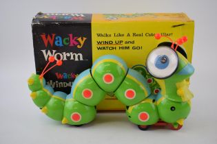Boxed Cragstan Wacky Worm from the Wacky Windups Collection, with key. Does work, box with losses.