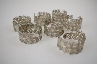 Silver filigree napkin rings marked .925. (7). Diameter 4.2cm. Weight 97.7g. In good usable