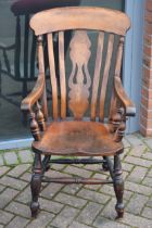 19th century elm / ash high backed farmhouse chair with saddle shaped seat, 102cm tall.