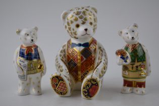 A Royal Crown Derby paperweight, Teddy Bear with blue bow tie, 12cm, gold stopper and red Royal