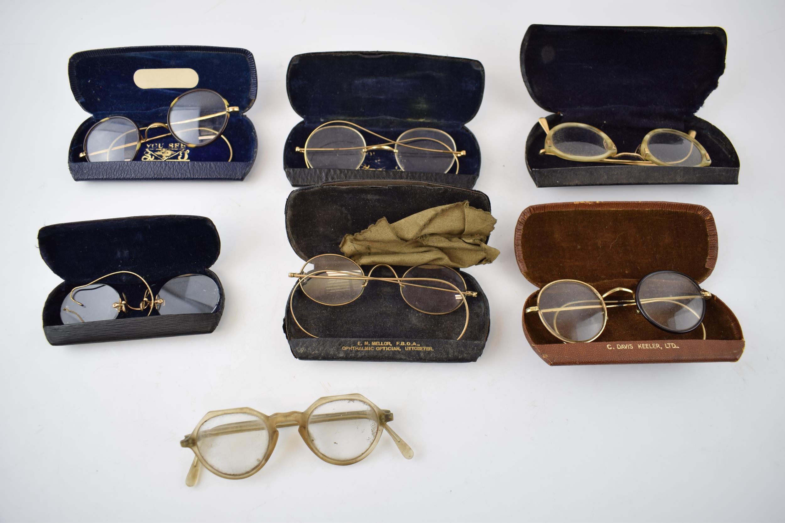 A collection of cased vintage spectacles in Georgian and later styles, some from Uttoxeter (Qty).