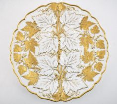 Early 20th century Meissen embossed cabinet plate with gilt leaves and vines, 26cm diameter, incised