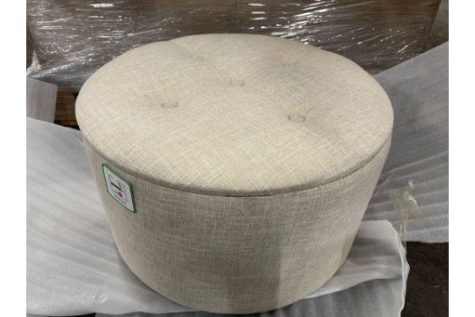 NEW LARGE CREAM ROUND 53CM OTTOMAN WITH STORAGE POCKETS - This round ottoman comes complete with a