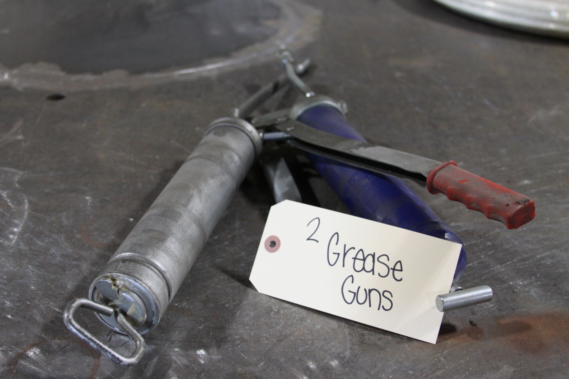 Two Grease Guns