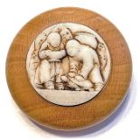 A DIVISION ONE GLASS IN WOOD FIGURAL BUTTON