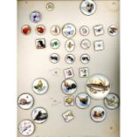 A CARD OF ASSORTED DIVISION THREE CERAMIC BUTTONS