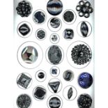 A CARD OF DIVISION ONE ASSORTED BLACK GLASS BUTTONS