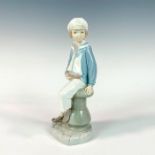 Boy With Yacht 1004810 - Lladro Porcelain Figurine