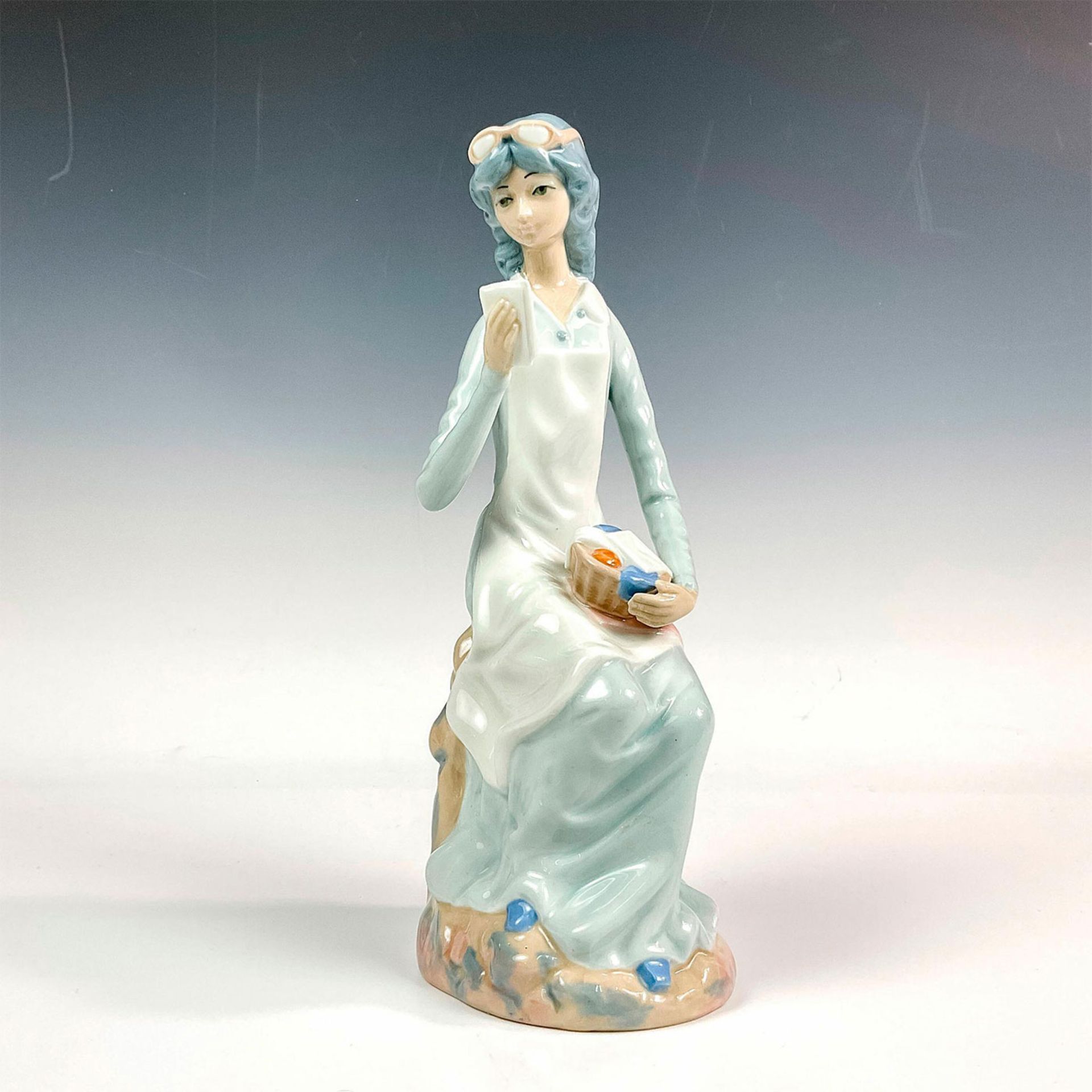 Casades Porcelain Seated Woman Figurine