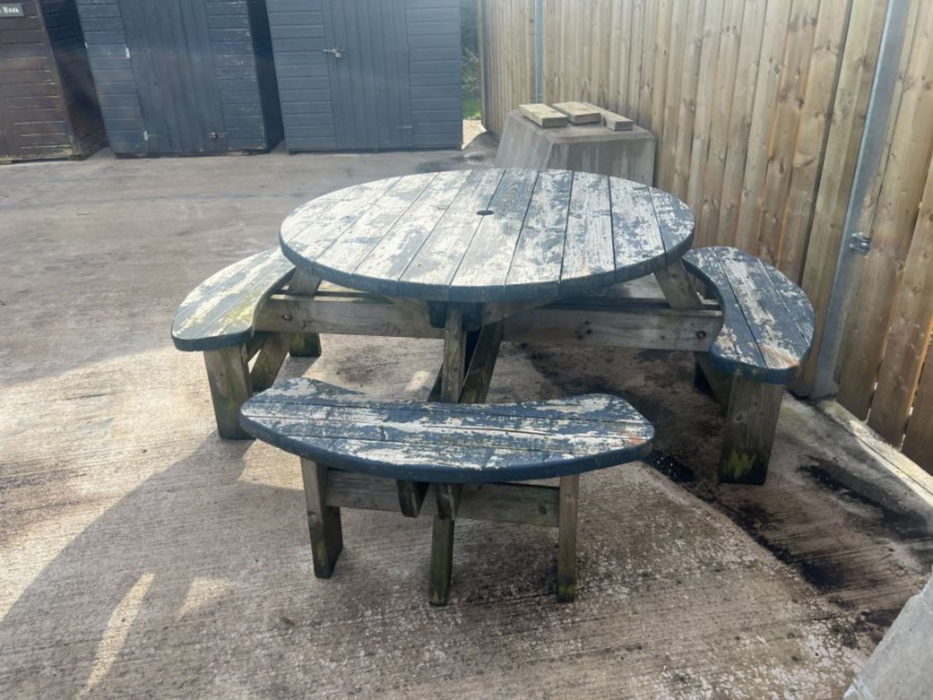 ROUND WOODEN PICNIC TABLE - LOCATED AT CASTLE ARCHDALE CARAVAN PARK - **BUYER TO HAVE IT REMOVED