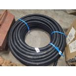 ROLL OF BLACK PLASTIC PIPING