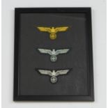 German framed collection of cloth NCO breast eagles.