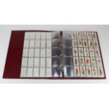 Large red binder of Military themed cigarette card sets (x16), incl Players, Wills, Ogdens,