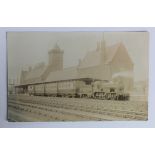 Railway station postcard. Maryport Cumberland, real photographic postcard, interior with steam train