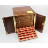 Coin Cabinet: Large mahogany, 28-tray coin cabinet by Peter Nichols, with spaces of various sizes.