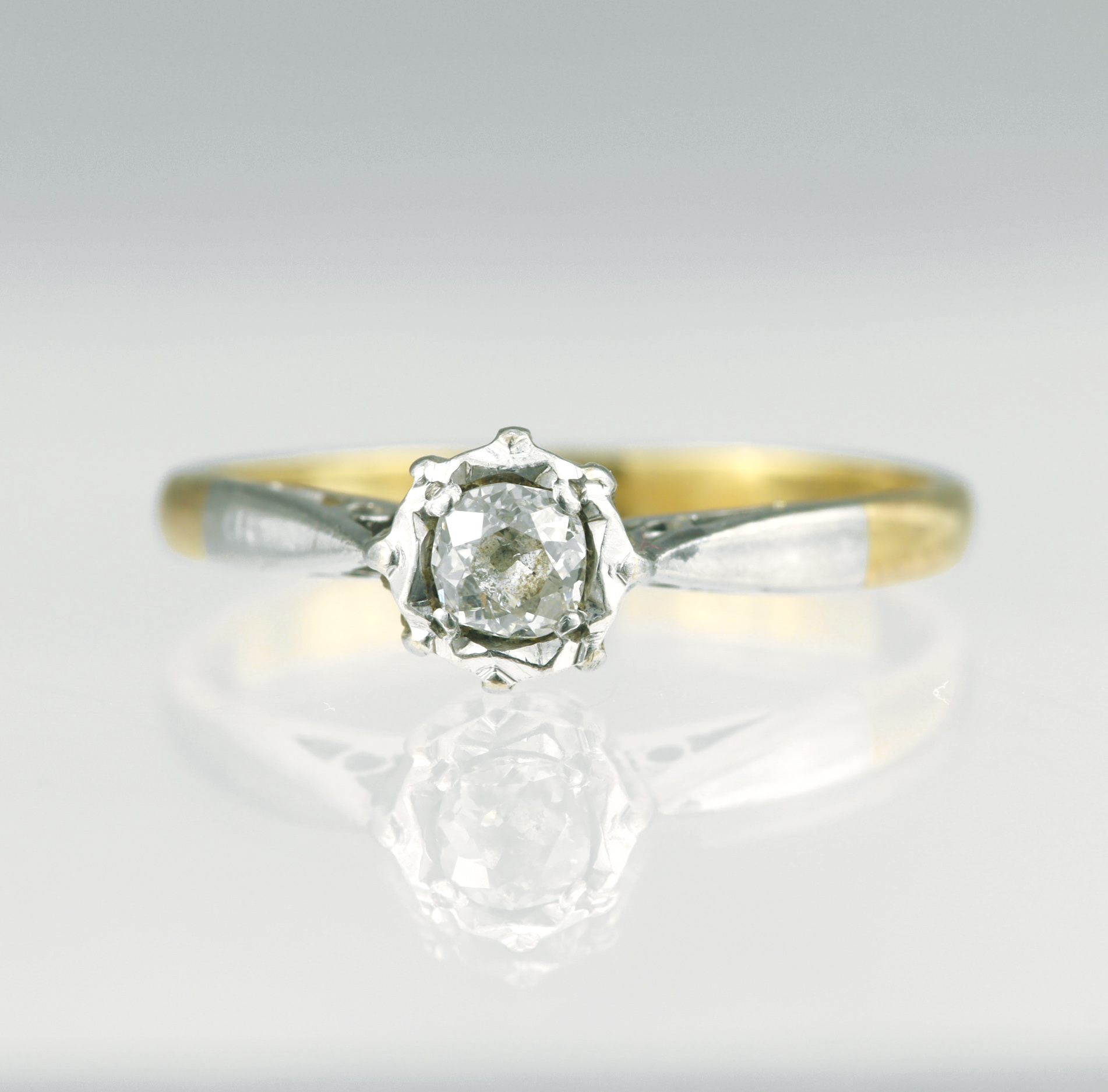 Yellow gold (tests 18ct) diamond solitaire ring, one old cut cushion approx 0.14ct, estimated colour