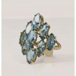 9ct yellow gold Swiss blue topaz cluster dress ring, nine marquise mixed cut topaz each measuring