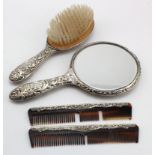 Part silver mounted dressing table set comprising hand mirror, hair brush & two combs (missing