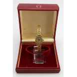 Ladies 9ct cased Omega manual wind wristwatch on a 18ct non Omega bracelet. Total weight 19g. In