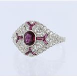 White metal tests platinum ruby and diamond art deco style cluster ring, principle oval mix cut ruby