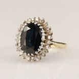 9ct yellow gold diamond and sapphire cluster ring, oval cut sapphire measures 11mm x 8mm,