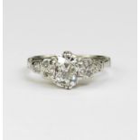 Platinum (tests 950) diamond solitaire, old cut cushion approx 1.13ct, flanked with trefoil set