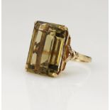 Yellow gold (tests 9ct) smokey quartz cocktail ring, rectangular cut smokey quartz measures 19.8mm x