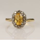 Yellow gold (tests 18ct) diamond and topaz cluster ring, oval mixed cut golden topaz measures 7.