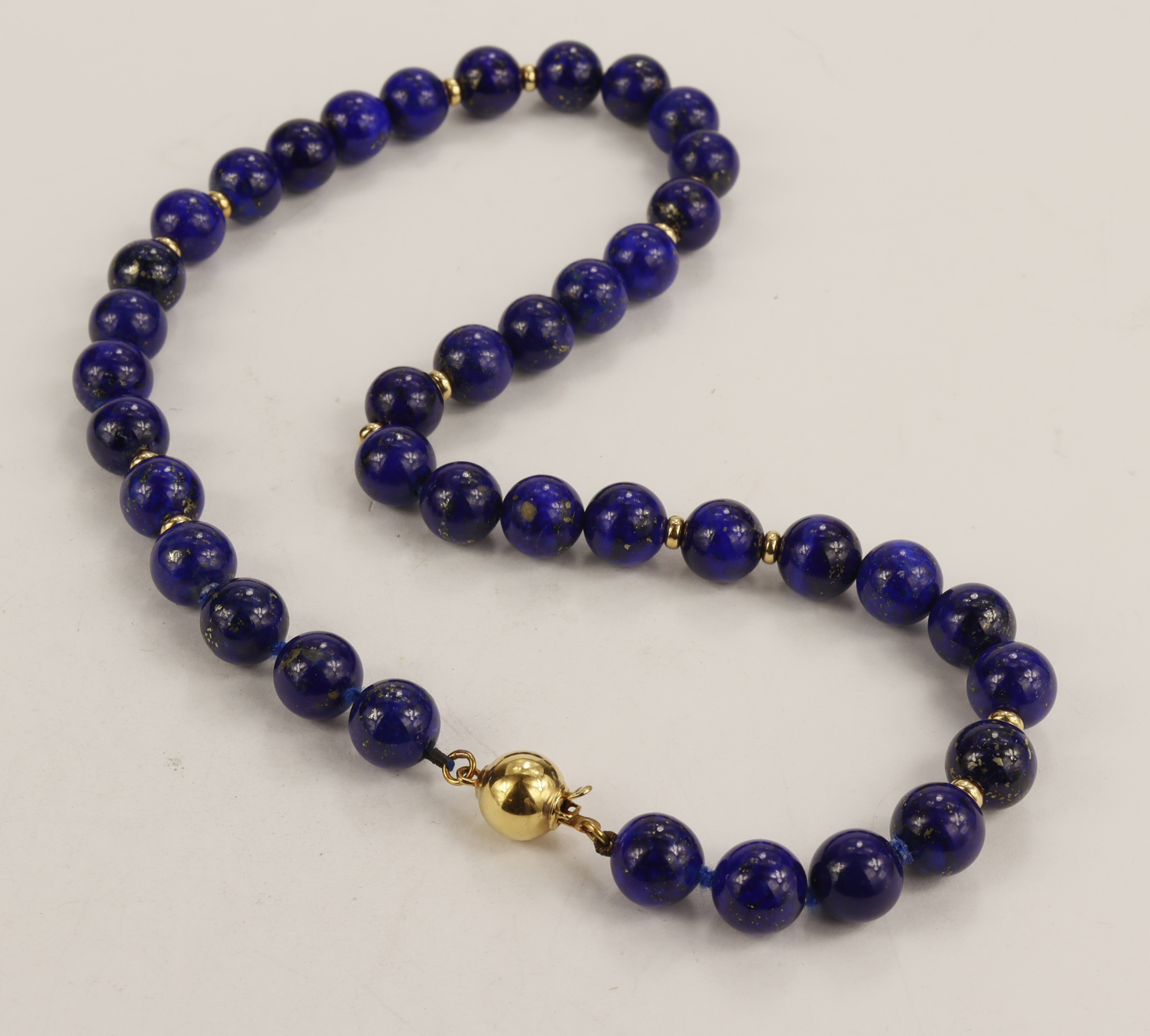 Lapiz lazuli single row beaded necklace with fourteen 9ct yellow gold beaded spacers, lapis beads