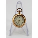 Ladies yellow metal (stamped 18k and tested also) open face pocket watch. The inside back plate