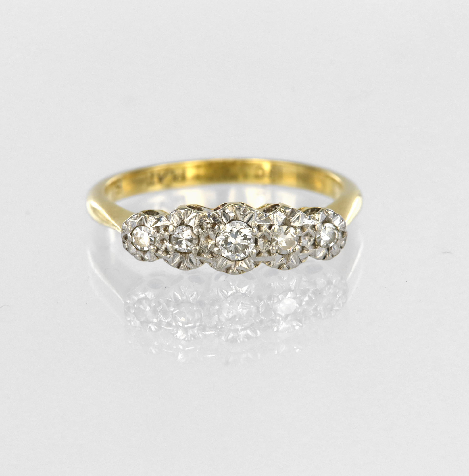 18ct yellow gold and platinum graduated five stone ring set with five round brilliant cut diamonds