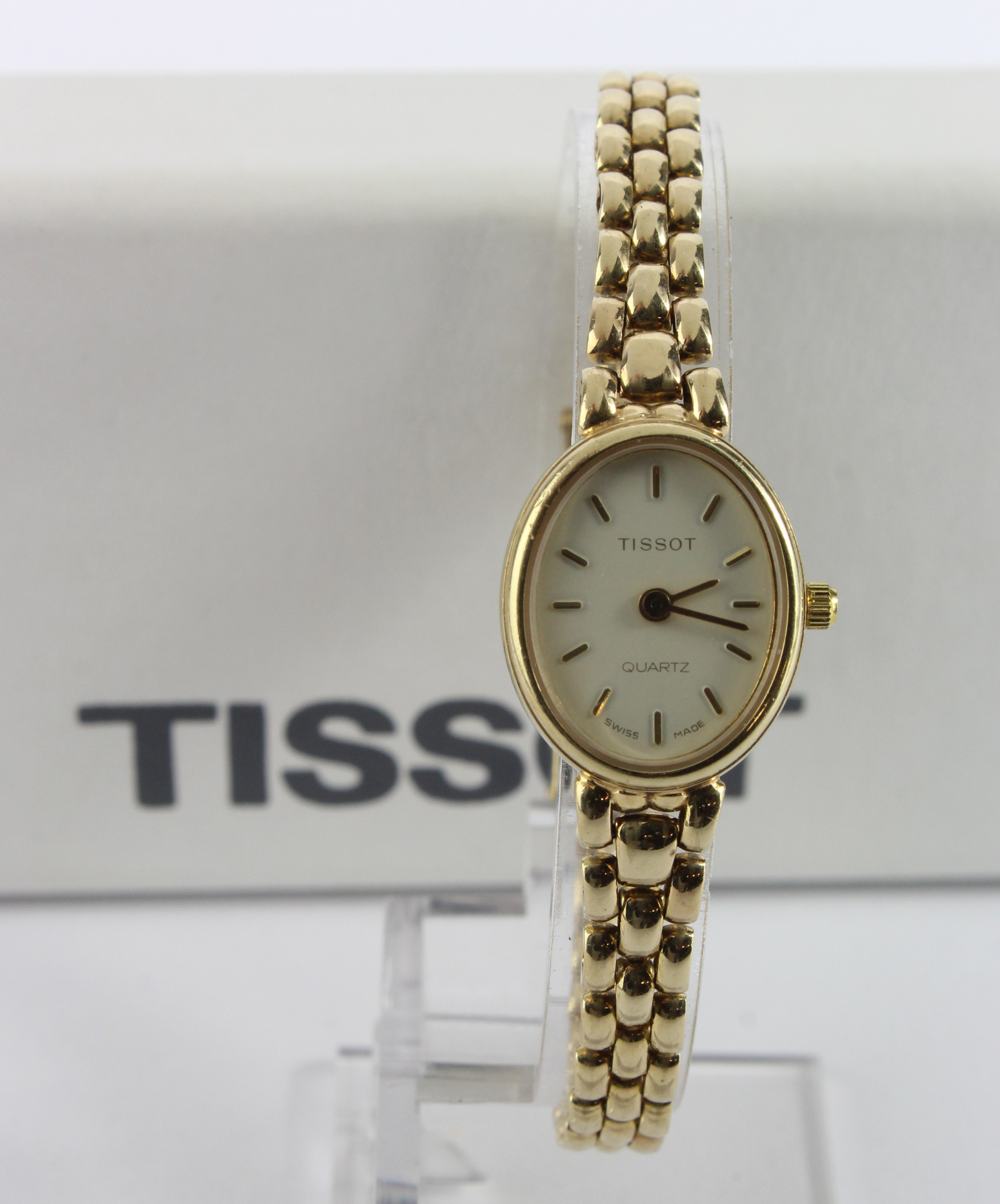 Ladies 9ct cased Tissot quartz wristwatch. On an 9ct bracelet. Total weight 18.1g. Boxed with some - Image 2 of 2