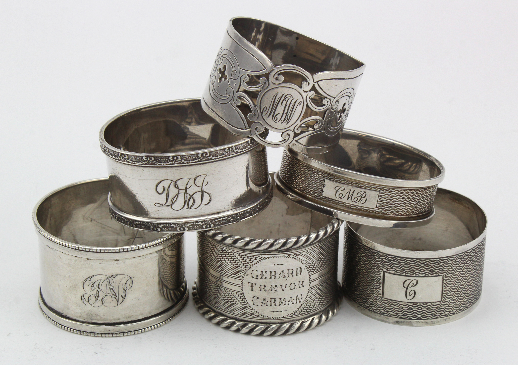 Six silver napkin rings, various makers and dates (all British hallmarked) includes a Victorian